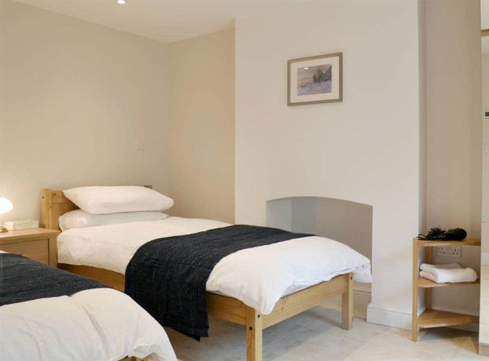 Comfortable twin bedroom at The Stables in Marksbury, near Bath, Avon