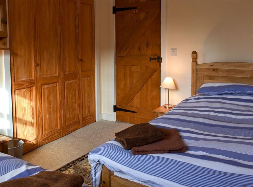 Relaxing twin bedroom (photo 2) at The Stables, Mill Farm in Okeford Fitzpaine, Dorset
