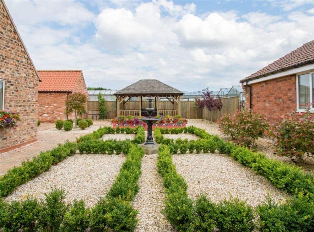 Ornamental garden features at The Stables in North Somercotes, near Louth, Lincolnshire