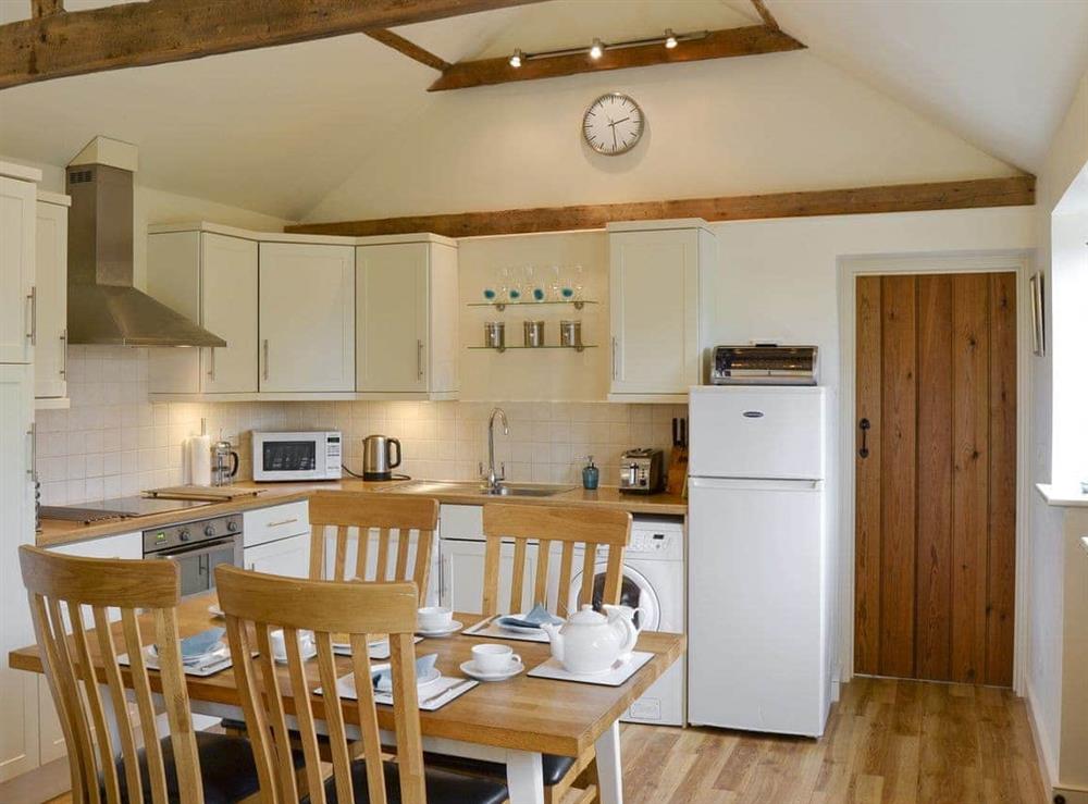 Well-equipped fitted kitchen with convenient dining area at The Stables in Occold, Nr Eye, Suffolk., Great Britain