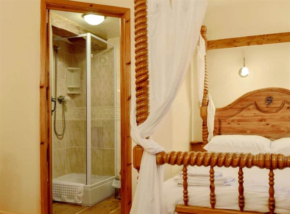 Bedroom with en-suite shower room at The Stables in Onecote, Staffordshire