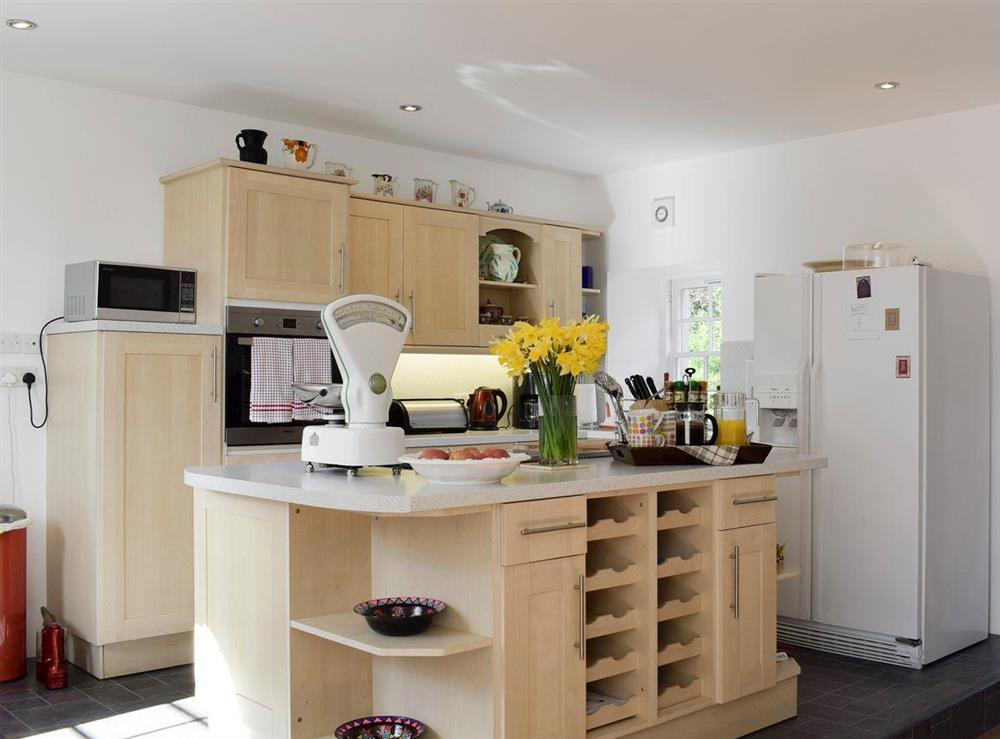 Lovely kitchen area with useful ‘island’ at The Stables in Pitcairlie, near St Andrews, Fife