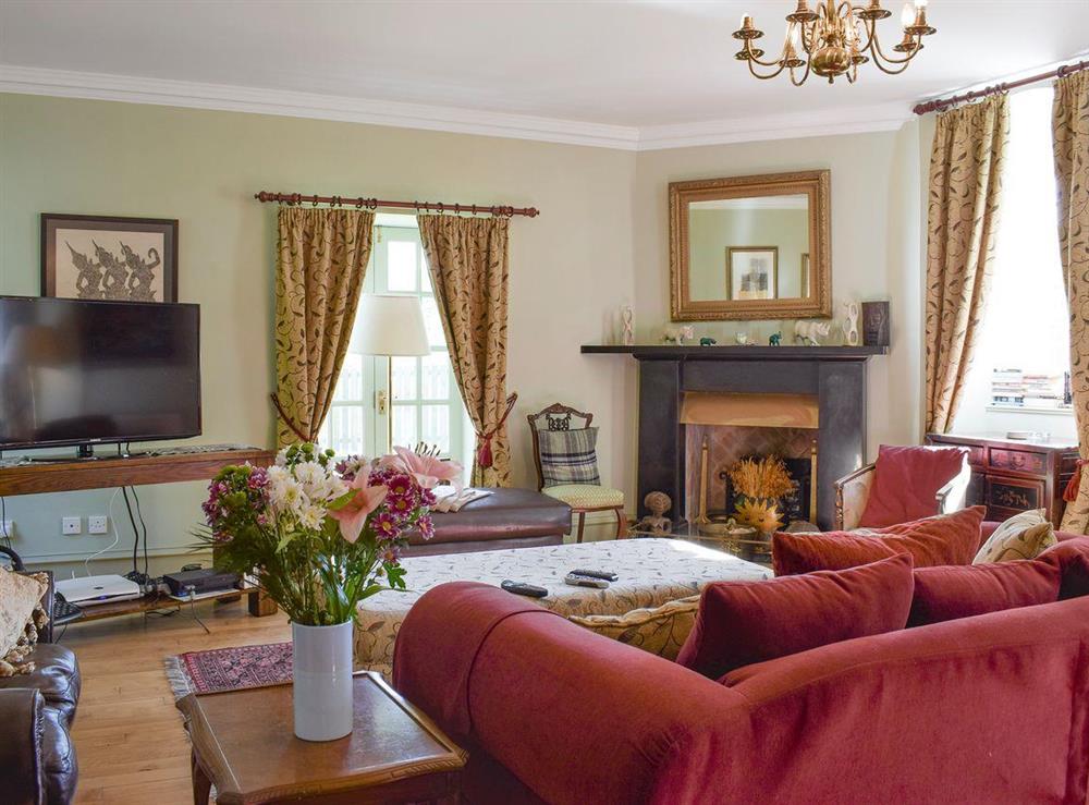 Warm and welcoming living room at The Stables in Pitcairlie, near St Andrews, Fife
