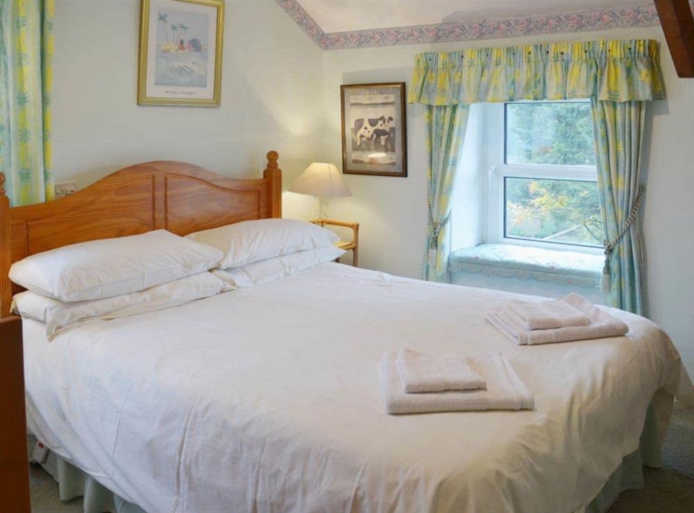 Beamed double bedroom at The Stables in Rezare, near Launceston, Cornwall