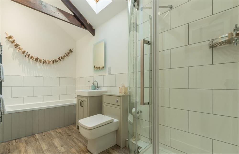 The Stables, St Agnes. Family bathroom with bath, shower, wash basin and WC at The Stables, St Agnes 