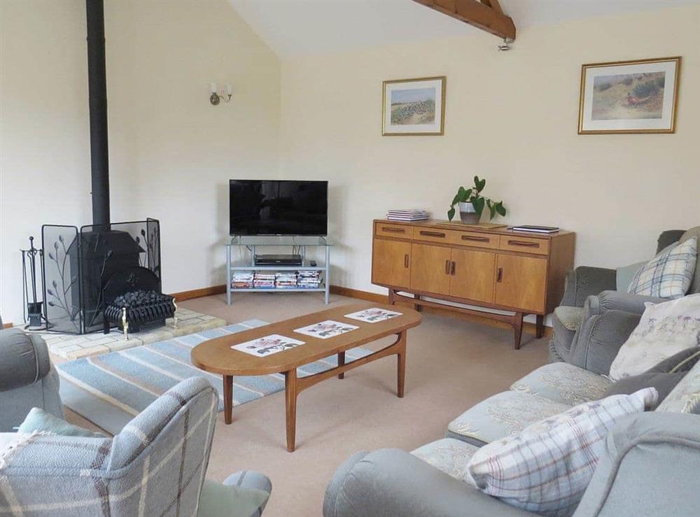 Spacious beamed living room at The Stables in Thrigby, Great Yarmouth, Norfolk., Great Britain