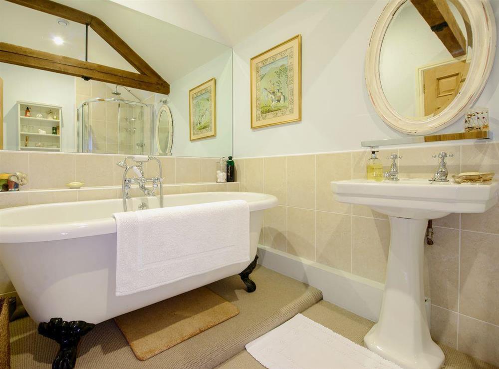 Bathroom with roll-top bath at The Stables in Weedon, near Daventry, Northamptonshire
