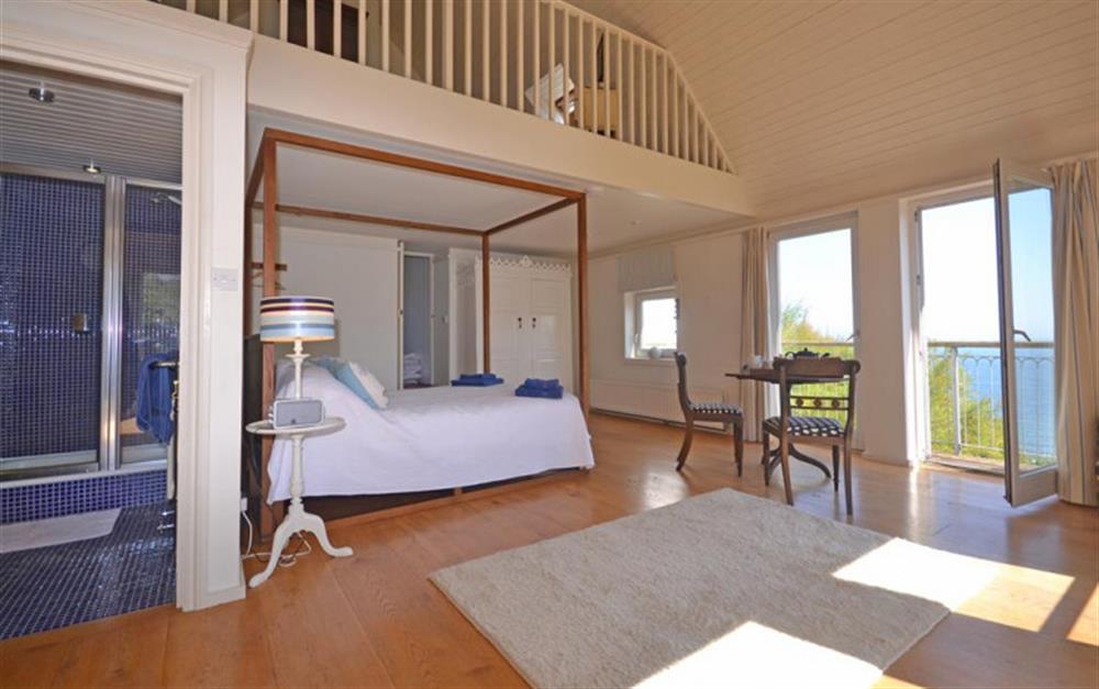The stunning master suite with views over the sea. at The Station Officer's House in East Prawle