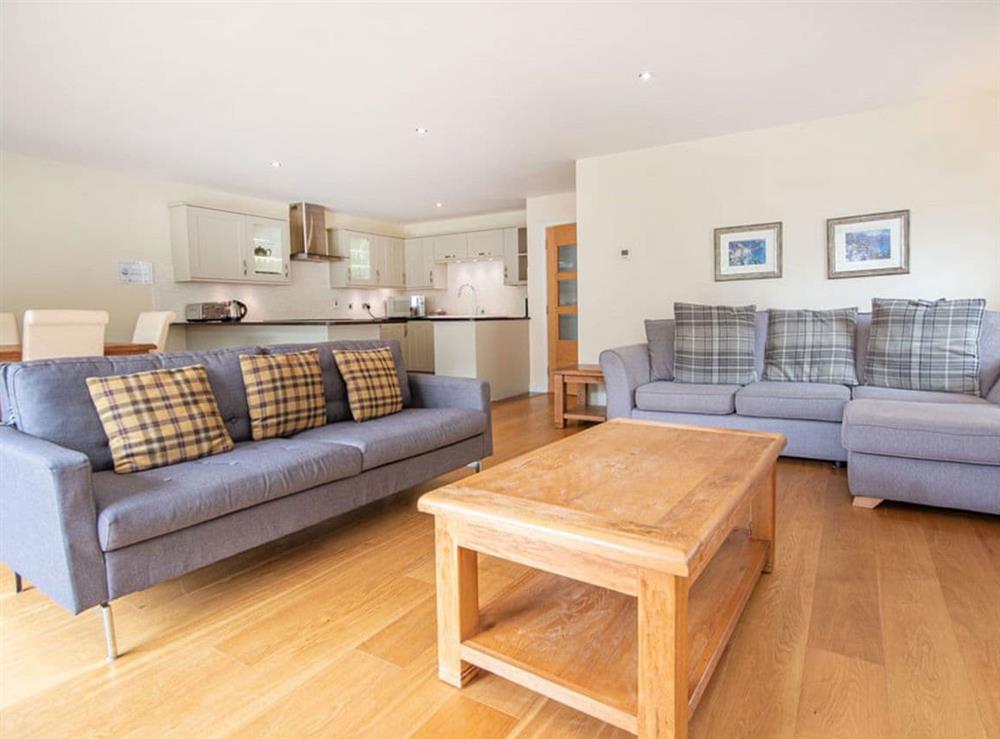 Open plan living space at The Steading Apartment, No9 in Aviemore, Inverness-Shire