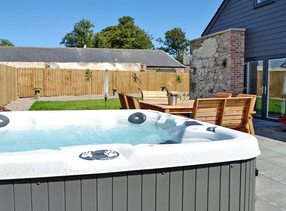 Relaxing, private hot tub at The Steading in Near Montrose, Angus
