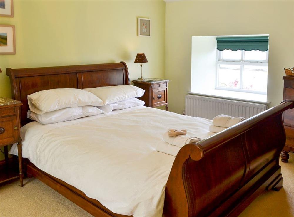 Tranquil bedroom with kingsize bed at The Steadings in Alnwick, Northumberland