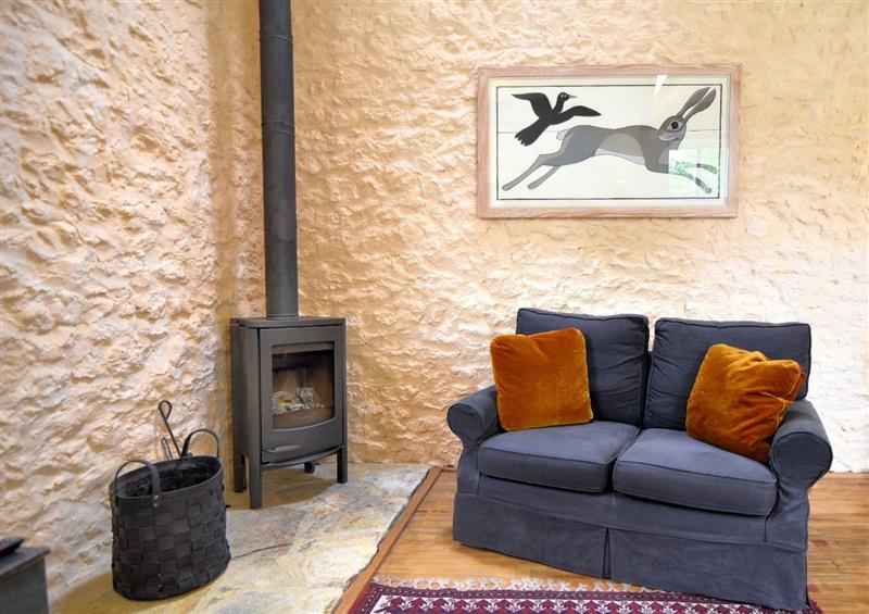 Relax in the living area at The Stone Barn, Bridport