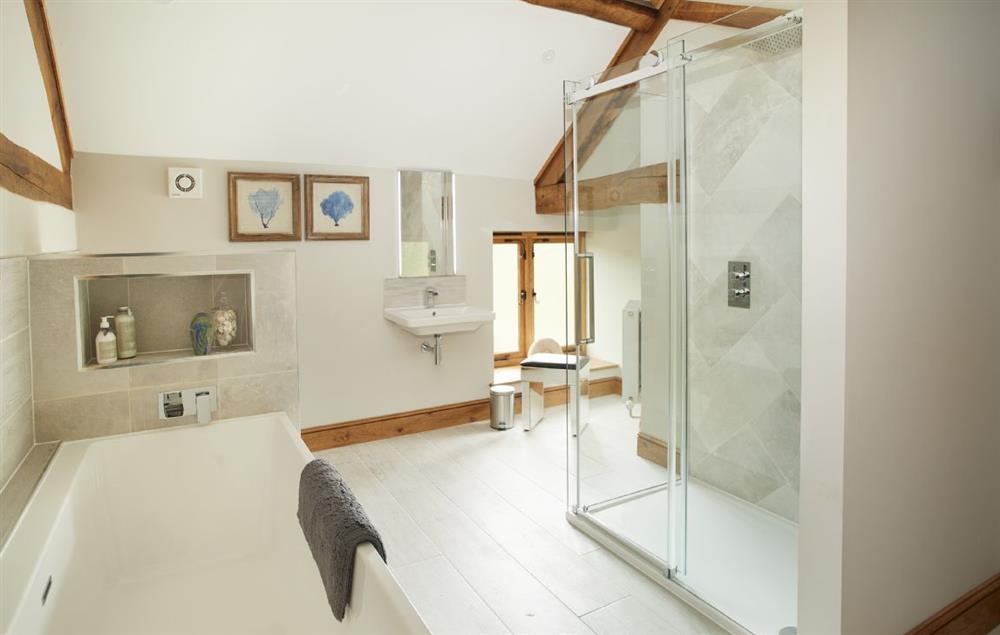 Bathroom with bath and separate walk-in shower at The Stone Barn, Downton-on-the-Rock
