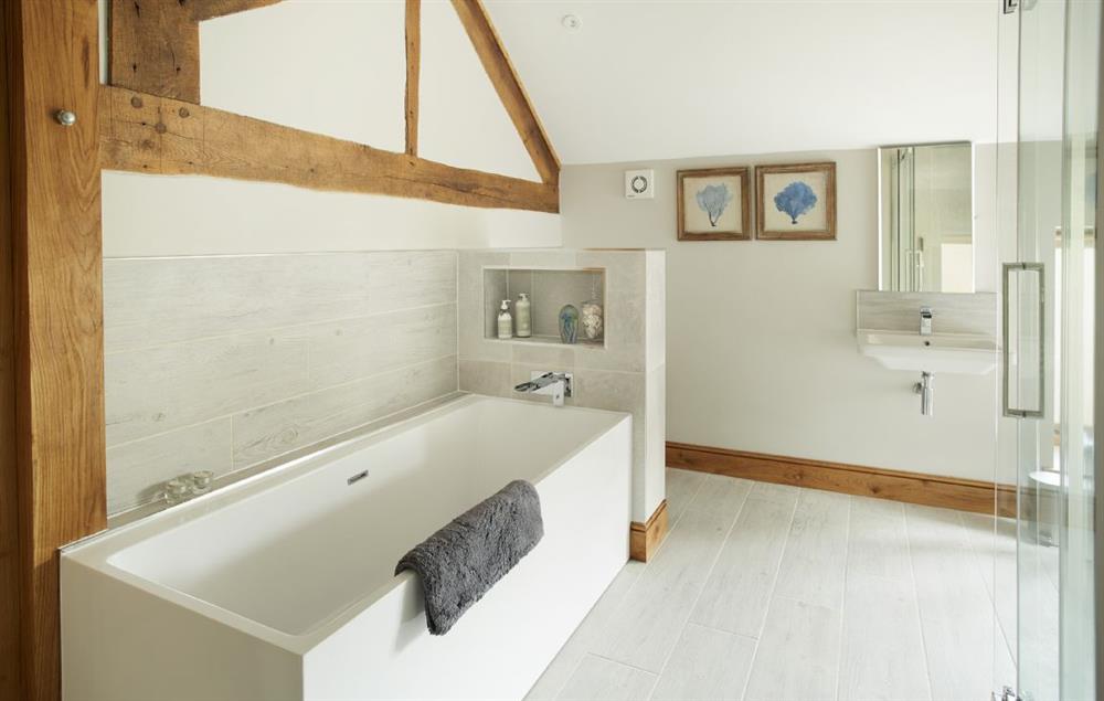 En-suite bathroom with bath and separate shower at The Stone Barn, Downton-on-the-Rock