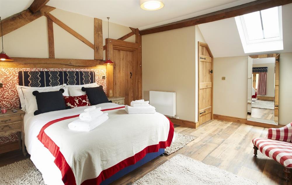 Master bedroom with 5’ king-size bed and en-suite bathroom (photo 2) at The Stone Barn, Downton-on-the-Rock