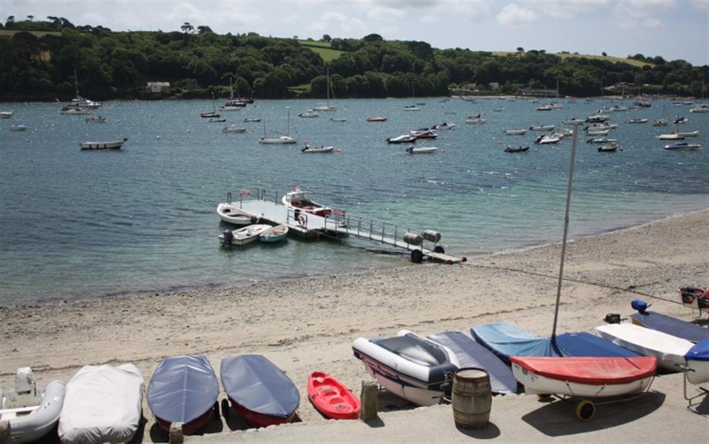 The beach at Helford Passage and the foot-ferry which takes you across to Helford Village. at The Strand in Helford Passage