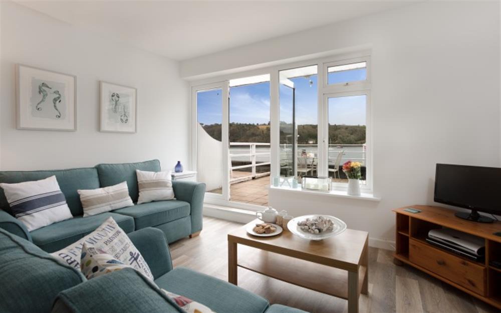 The beautifully renovated living area in Strand, with stunning river views. at The Strand in Helford Passage