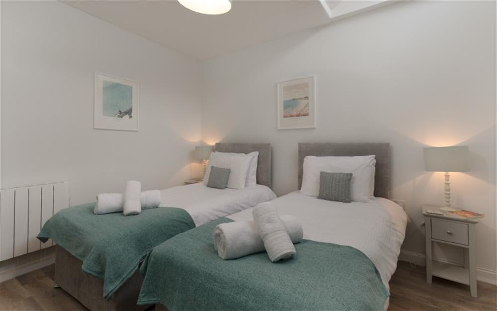The second bedroom also feels calm and relaxing. at The Strand in Helford Passage