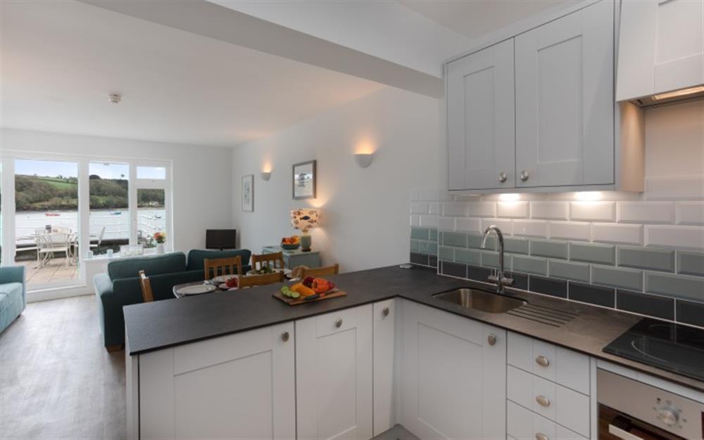 The Strand has a brand-new kitchen in tones of grey, white and teal. You'll find everything you need here for a family holiday. at The Strand in Helford Passage