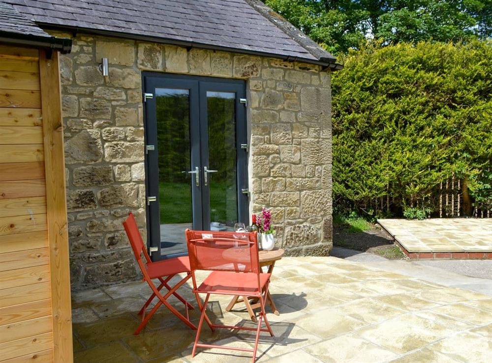 Paved patio area with outdoor furniture at The Studio at Westfield in Bellingham, near Hexham, Northumberland