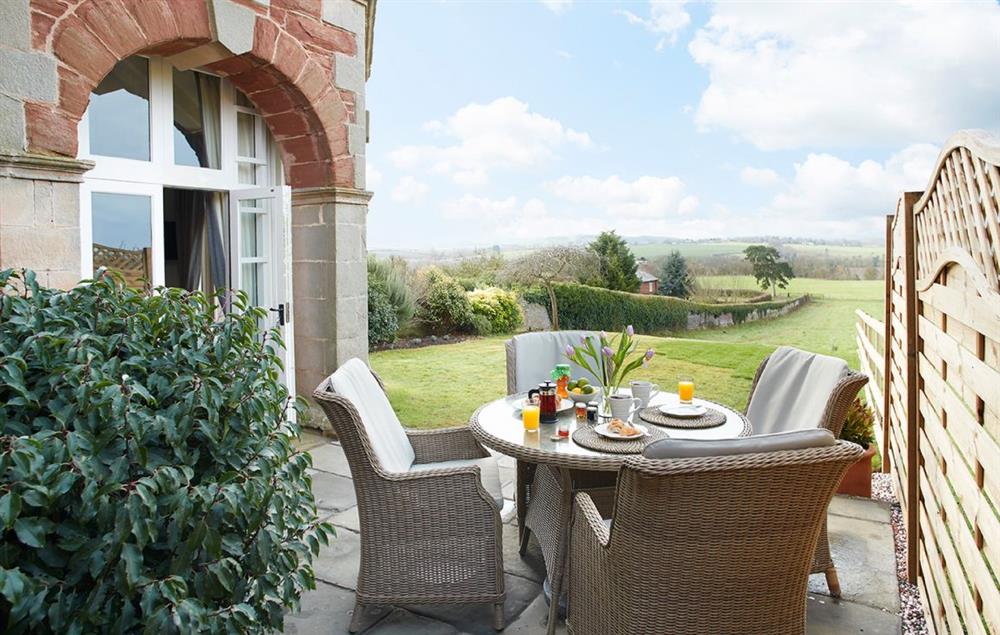 Private patio with enclosed garden at The Summer House, Eyton on Severn