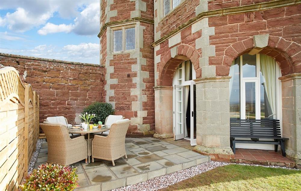 The private patio area offers reaching views of the garden at The Summer House, Eyton on Severn