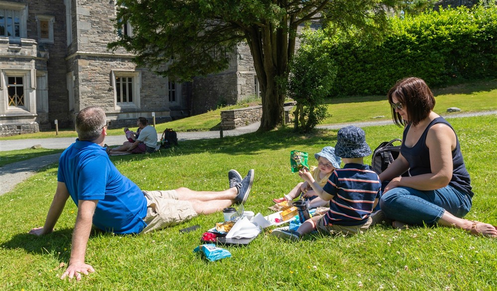 A family picnicking at The Summer House in Nr Hawkshead, Cumbria