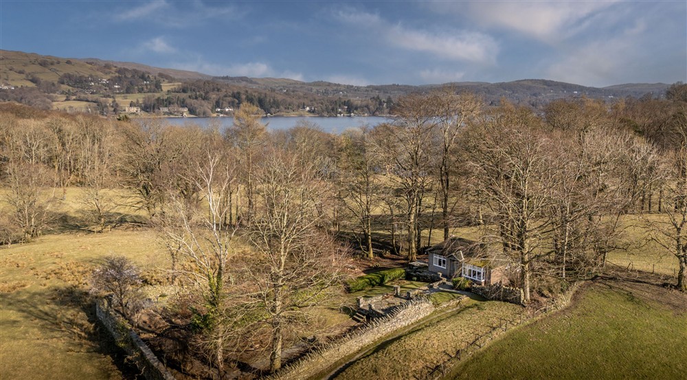 An aerial view of The Summer House, with Lake Windermere in the background, Cumbria at The Summer House in Nr Hawkshead, Cumbria