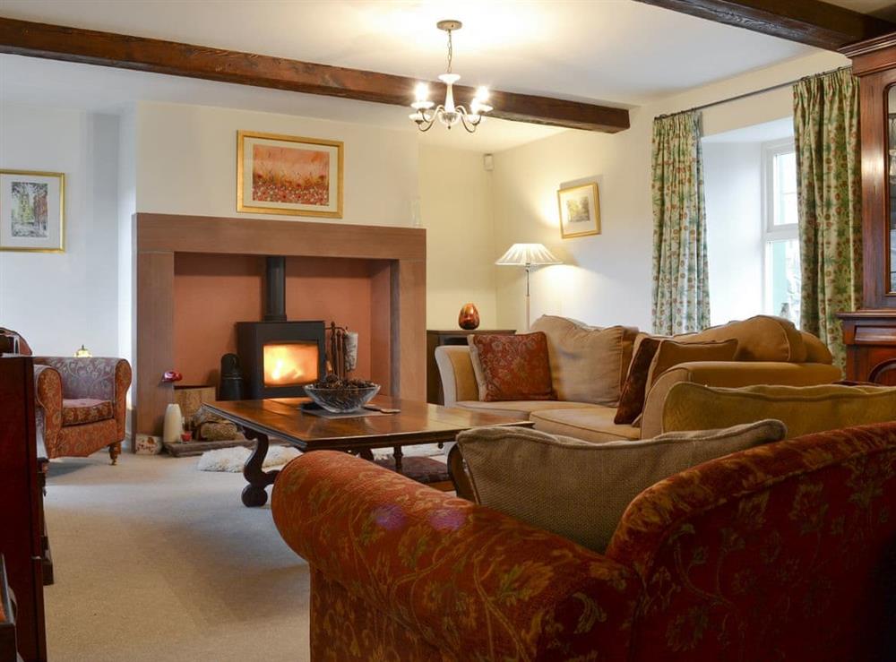 Welcoming living room with wood burner at The Sun in Ireby, Cumbria