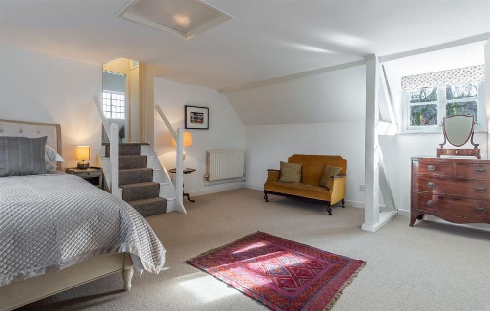 First floor: Seating area within this fabulous master bedroom at The Tack House, Near Holkham