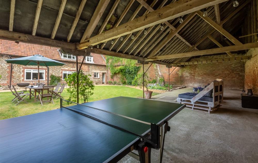Full size tennis table in the covered area at The Tack House, Near Holkham