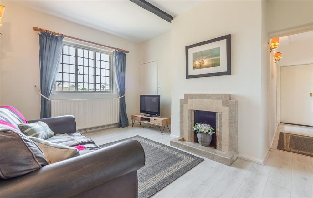 Ground floor: The snug room with lots of natural light at The Tack House, Near Holkham