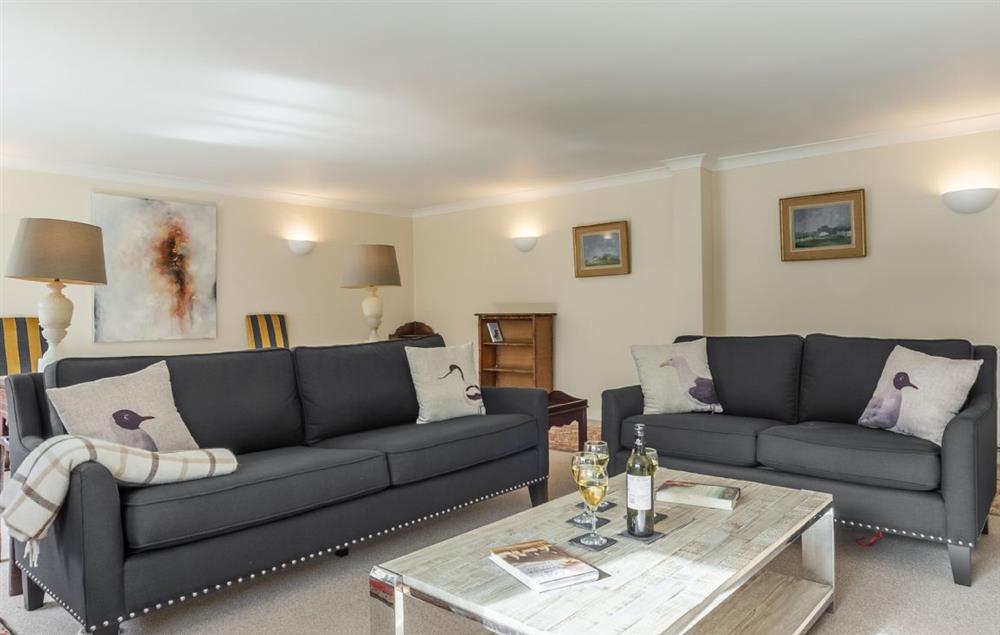 Ground floor: The stylish sitting room with comfortable sofas and plenty of light at The Tack House, Near Holkham