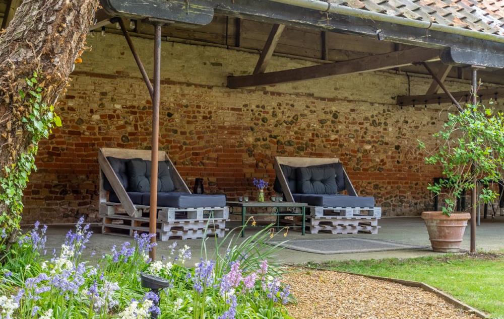 Loggia with comfortable seating at The Tack House, Near Holkham