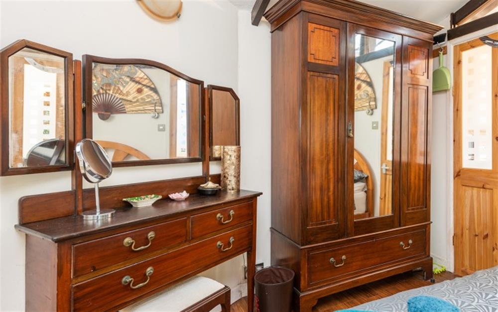 Plenty of space for your clothes in the double wardrobe. The dressing table is perfect for hair and make-up in preparation for a night out. at The Tea House in Penzance