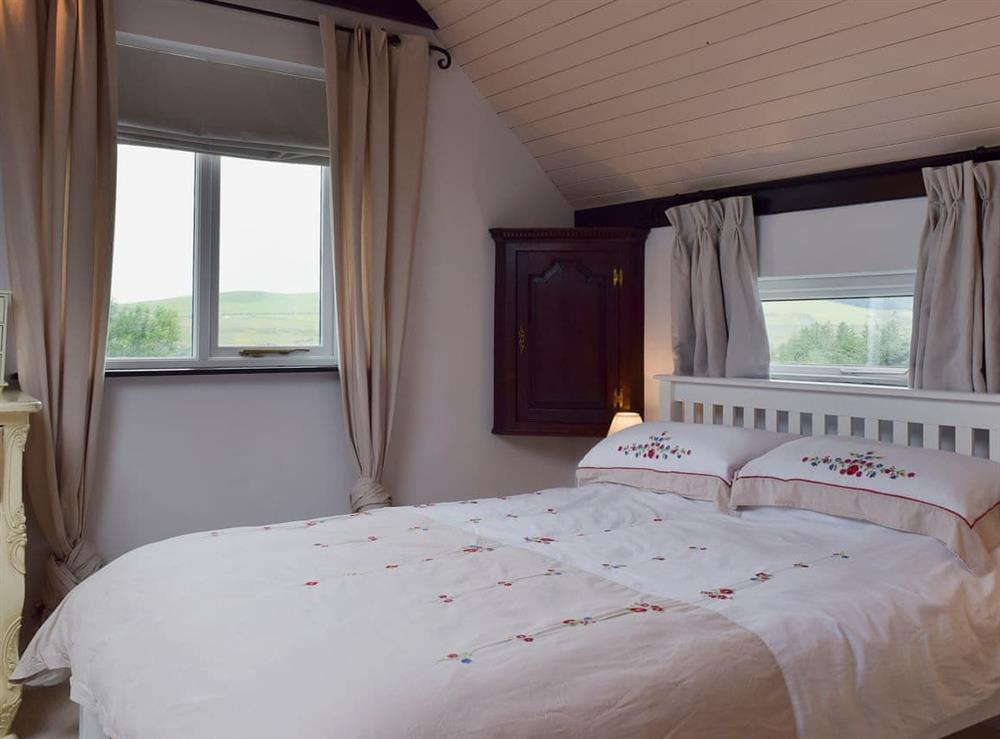 Comfortable bedroom with kingsize bed and beams at The Terrace in Rosebush, near Narberth, Dyfed