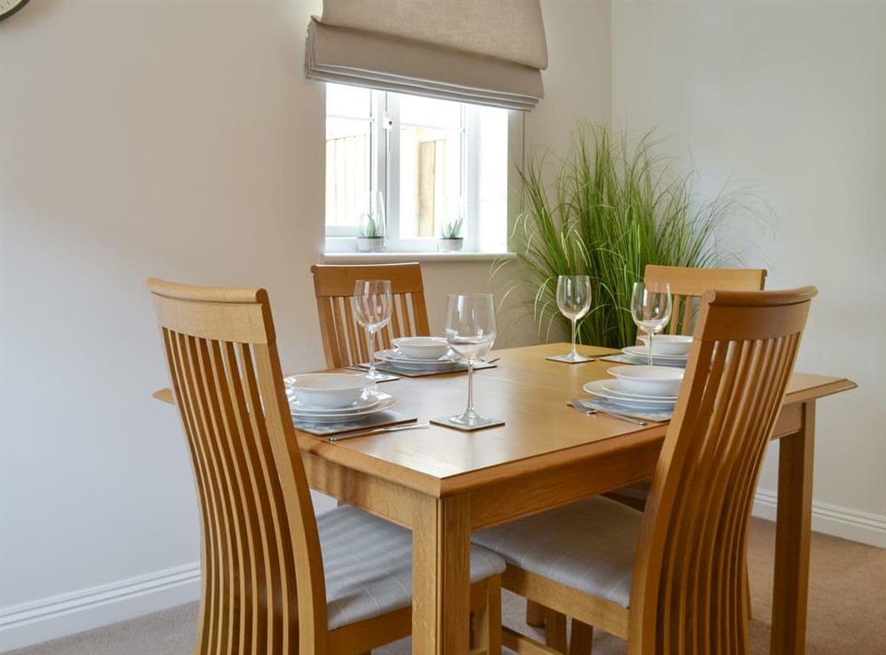 Elegant dining room at The Tides in Bridport, Dorset