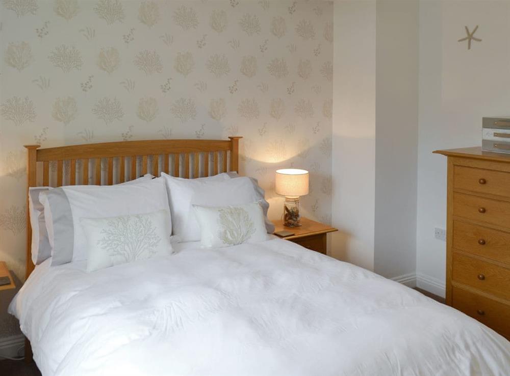 Inviting double bedroom at The Tides in Bridport, Dorset