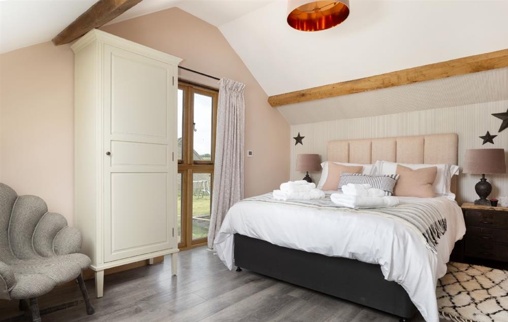 Bedroom with 5’ kingsize bed (photo 2) at The Timber Barn, Downton-on-the-Rock