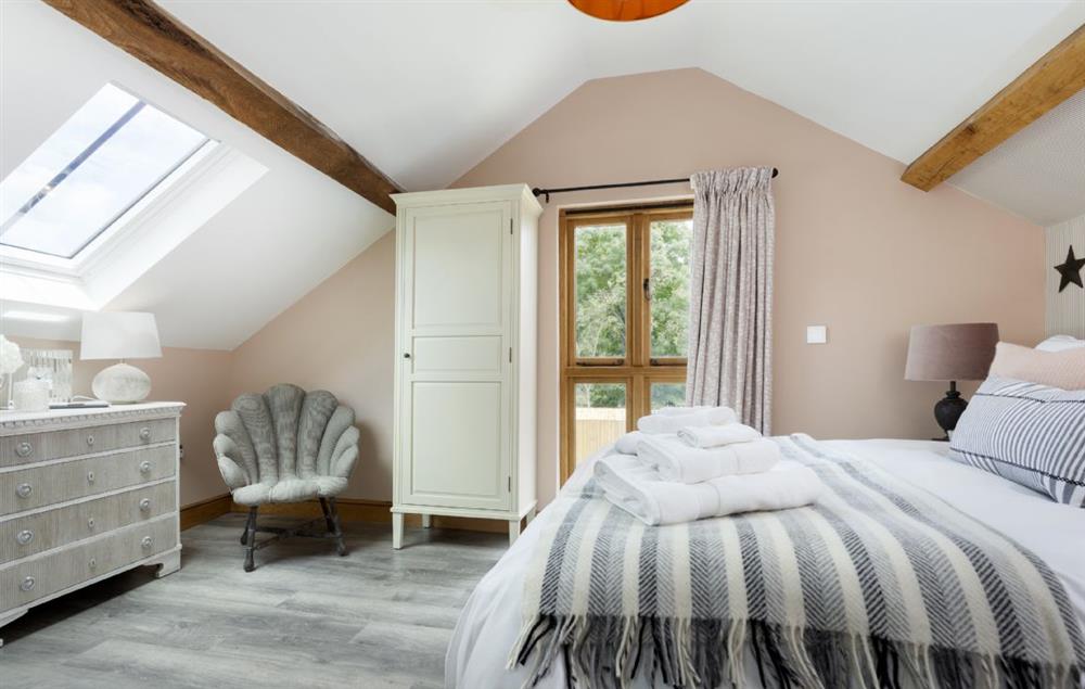 Bedroom with 5’ kingsize bed at The Timber Barn, Downton-on-the-Rock