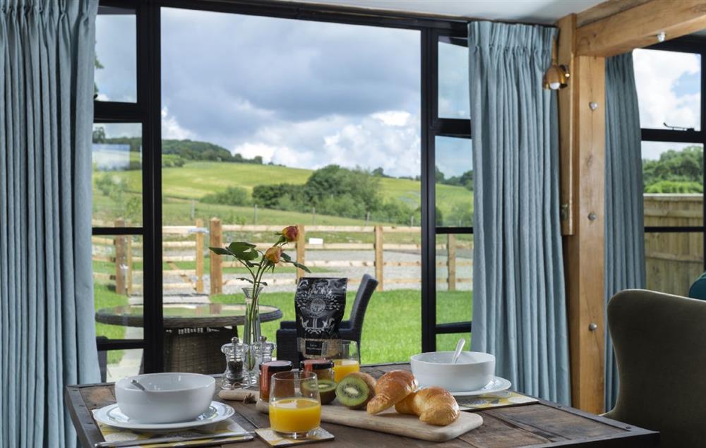 Folding doors open on to stunning views of the Downton Estate at The Timber Barn, Downton-on-the-Rock