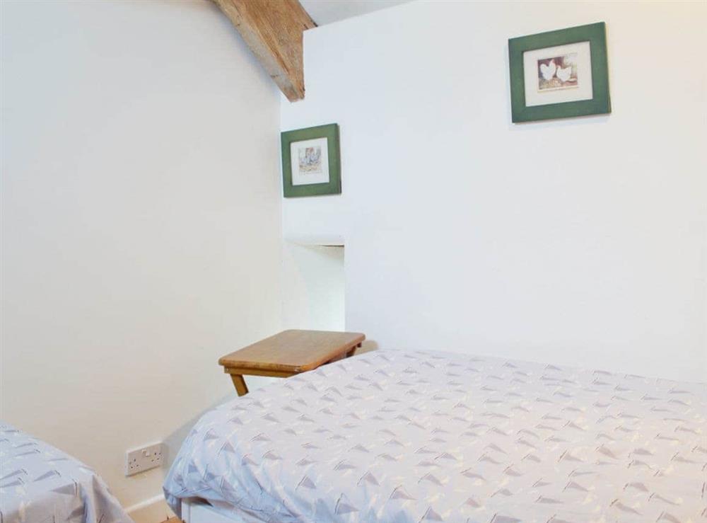 The cosy twin bedded room at The Tithe Barn in Huxham, near Exeter, Devon