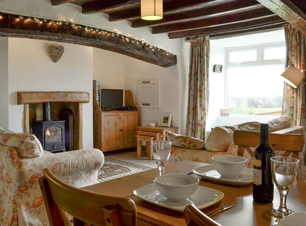 Characterful living/ dining room at The Tottsie in Bassenthwaite, near Cockermouth, Cumbria