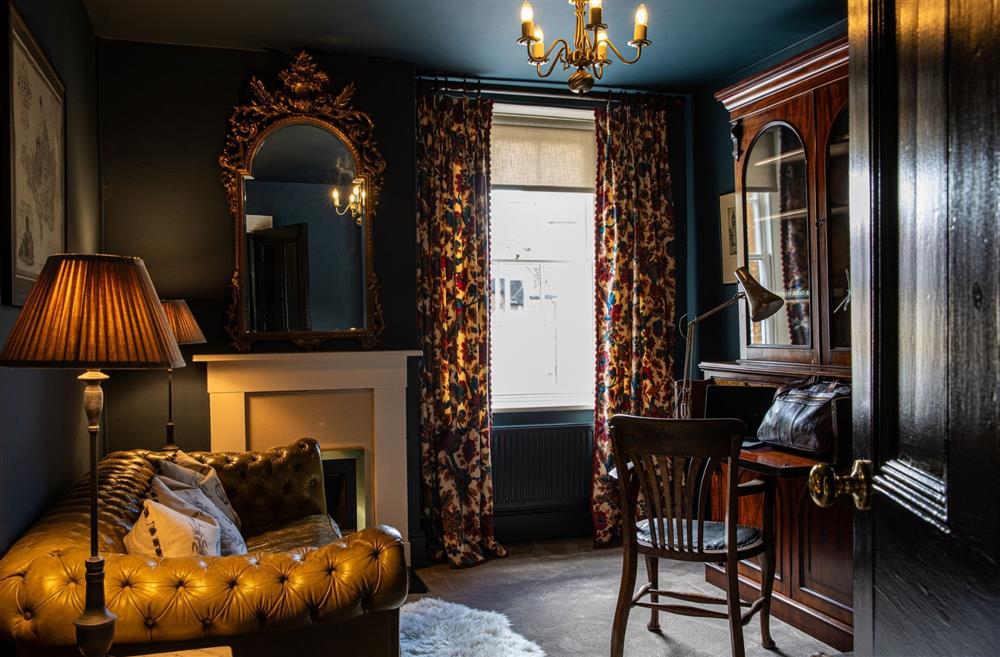 A formal sitting room with a writing desk