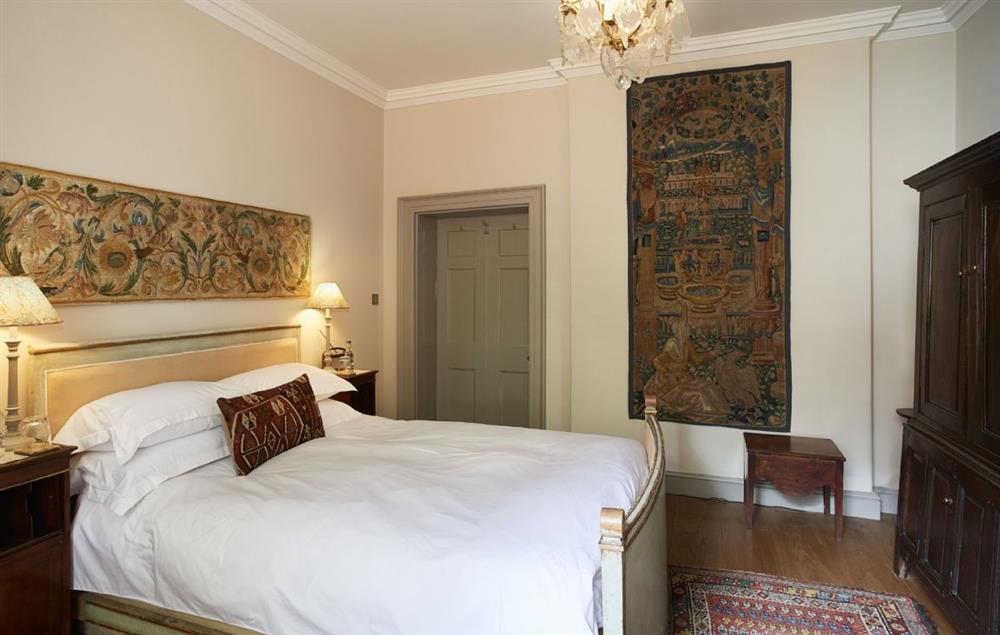 Bedroom with Persian rugs and tapestries at The Treasury, Aylsham near Norwich