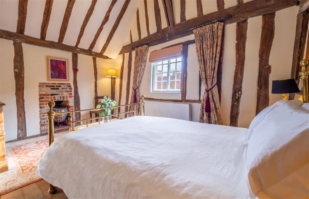 Bedroom one with 5’ king-size bed and vaulted ceiling (photo 2) at The Tryst, Lavenham