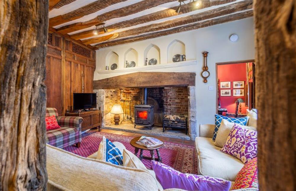 Sitting room with stunning inglenook fireplace at The Tryst, Lavenham