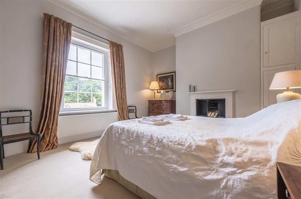 Bedroom four with a 5’ king-size bed at The Vicarage and Cottage, Great Limber