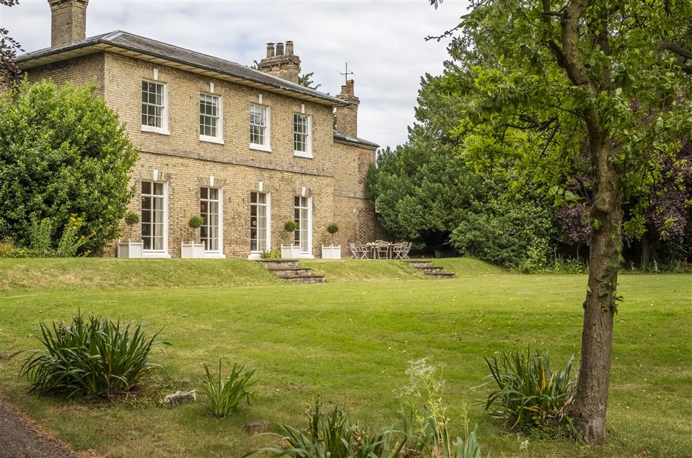 Striking garden view of this impressive house at The Vicarage and Cottage, Great Limber