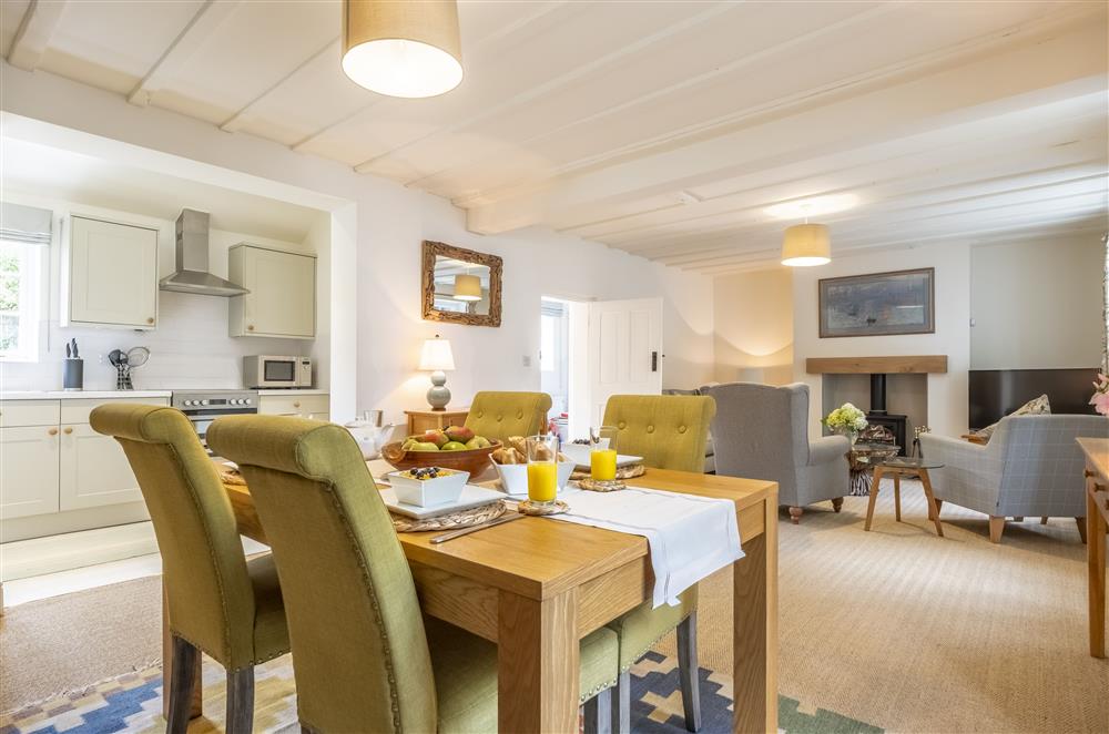 The open-plan kitchen, dining and sitting area with exposed beams at The Vicarage and Cottage, Great Limber